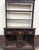 This is a stunning antique English oak pewter cupboard or Welsh style dresser featuring an architectural upper plate rack...
