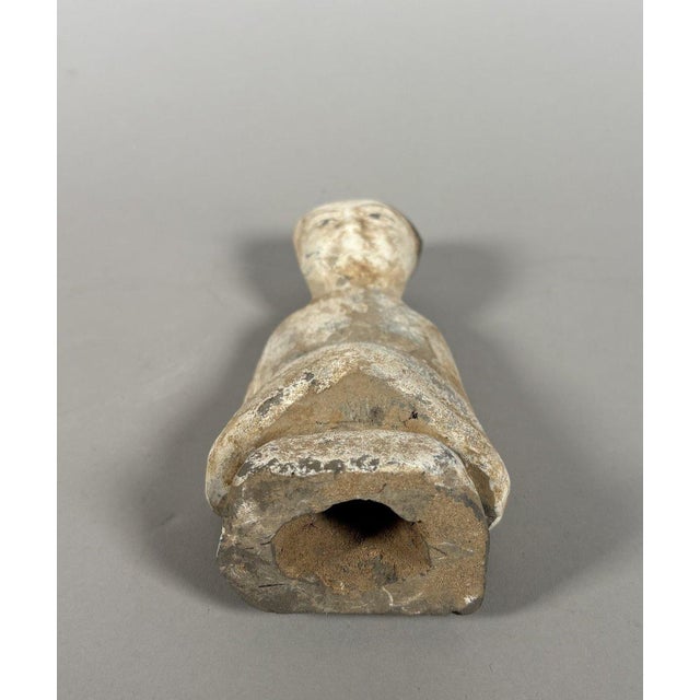 Sculpture of a Mingqi, China, Han Dynasty (206 BC to 221 AD). Sculpture of a seated lady with her hands clasped in the...