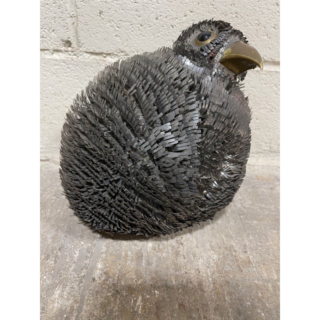 The cutest, puffy strip metal bird sculpture! Brass around eye and beak. Screams Bustamante, but no signature. I think...