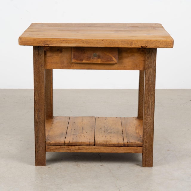 Late 19th century Hungarian rustic side table, crafted primarily in pine with a narrow upper drawer and useful lower...