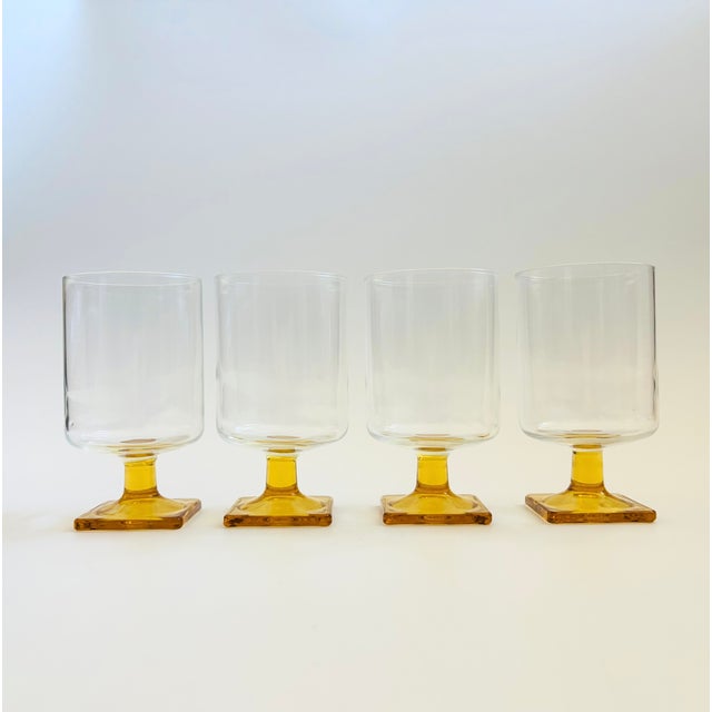 A set of 4 Mid Century wine glasses. Clear cylindrical tops contrast nicely with the yellow square bases. Made in the...