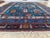 Hand-knotted entirely in wool — pile and foundation alike, a mark of genuine tribal craftsmanship — this vintage rug...
