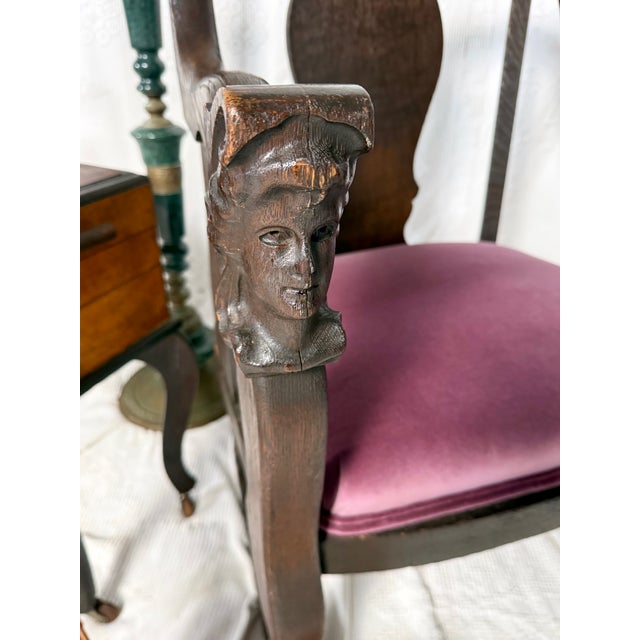 North American handcarved wooden rocker chair with details of a woman's head and hooves. Unique carved face chair. Dark...