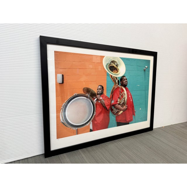 Design Plus Gallery presents a Framed Photograph of “Hot Eight Bass Section, NOLA” by Elsa Hahne. This vibrant color...