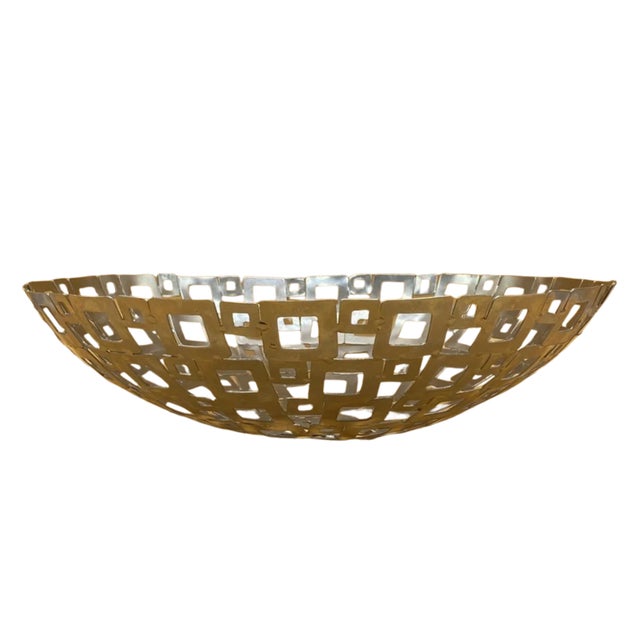 Boldly architectural and unmistakably Brutalist, this large vintage silver-plated fruit bowl is a striking example of...