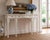 An elegant Maitland-Smith console table in the Chippendale taste, featuring finely carved mahogany construction finished...