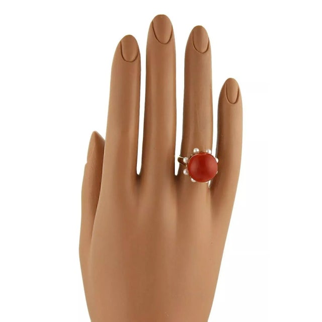 This is an impressive vintage ring, crafted from 14k yellow gold, it has a high shank crown like mounting with a large...