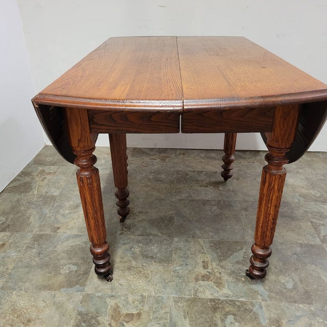 Wood Antique English Chestnut Drop-Leaf Dining Table With Five Turned Legs and Castors, C. 1820–1840 For Sale - Image 7 of 11