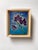 The artwork features a striking composition of dark orchids, with vivid details that emphasize their haunting beauty. The...