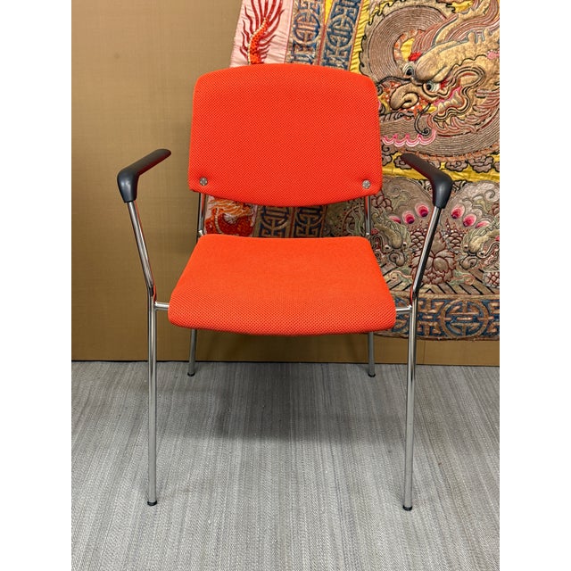 Design Plus Gallery presents an Orange Modernist Arm Chair from HighTower. The chair is cloth wrapped in a fire orange...