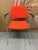 Design Plus Gallery presents an Orange Modernist Arm Chair from HighTower. The chair is cloth wrapped in a fire orange...