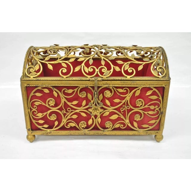 Vintage Hollywood Regency Style Gold Gilt Metal Red Lined Jewelry Trinket Storage Box. Item features a red plush interior,...