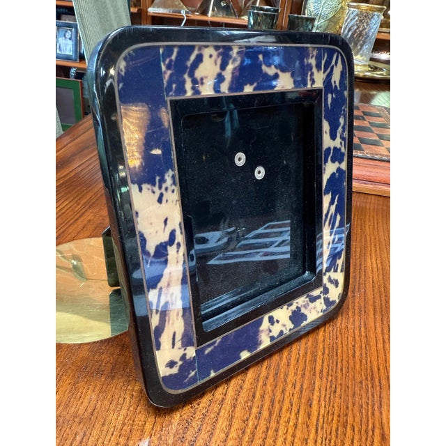 Stylish blue and cream marbled resin photo frame adds a touch of modern sophistication to any decor. The frame features a...