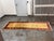 Design Plus Gallery presents a 3ft1in × 9ft4in Vintage Hand Knotted Wool Runner. This wool runner displays a golden field...