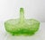 French green molded glass basket, to be used as a center piece or empty pocket. Decorated with vegetal and floral motifs...