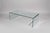 Incredible classic bent glass coffee table with a simple design. Table consists of one large sheet of tempered glass,...