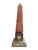 Vintage Grand Tour style marble obelisk. Features a carved rouge marble tower supported by ball feet, mounted on a dark...