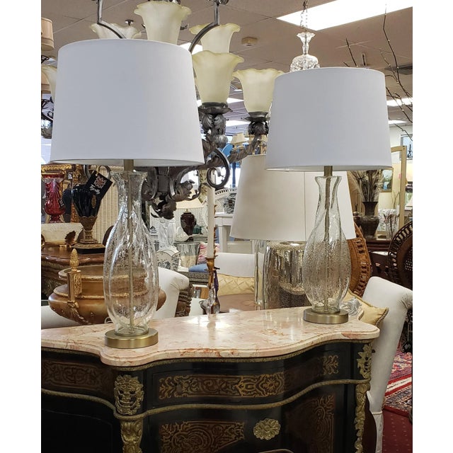 The body of each lamp is crafted from clear bubble glass. The twisted teardrop shape adds a sense of fluidity and...