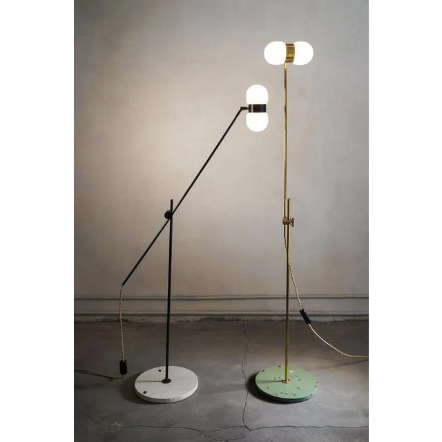 Set of 2 nuvol double floor lamps by contain dimensions: d28 x h150 cm each materials: brass structure and matte or glossy...