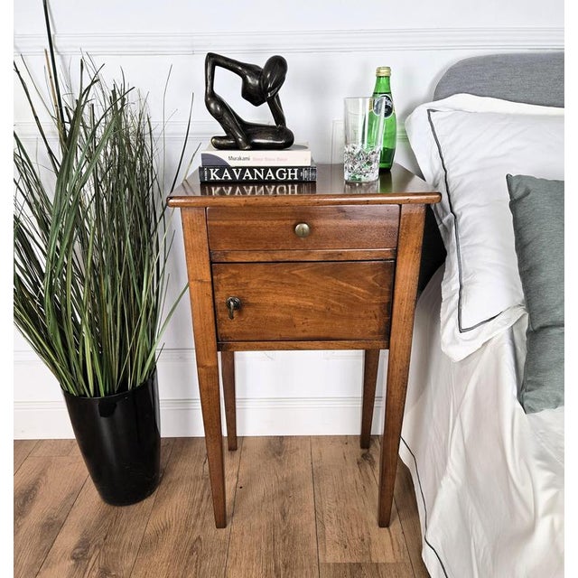 Very elegant and refined Italian 1950s Mid-Century Modern pair of bedside tables with top drawer, central drawer and brass...