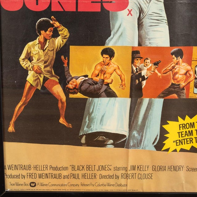 A framed Brittish Quad advertising poster of "Black Belt Jones" and "The Deadly Trackers" (1973-1974). The poster features...