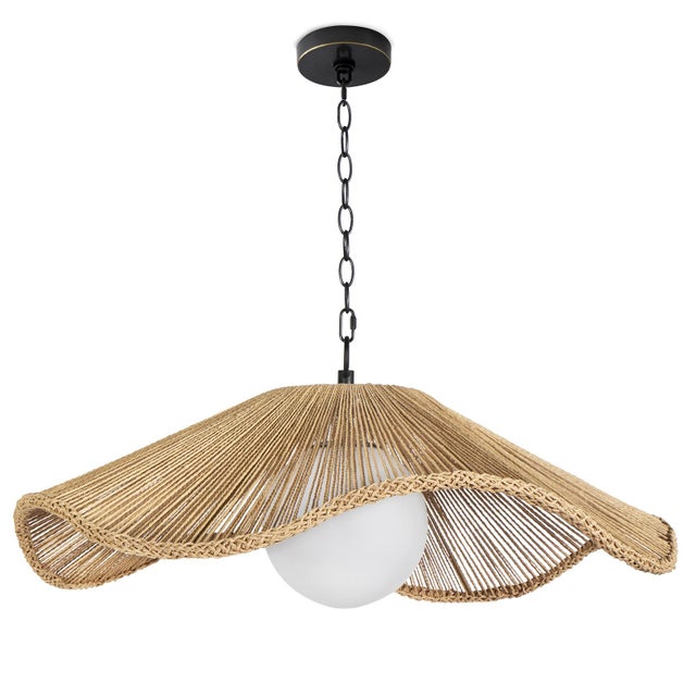 Seaside cafes in the south of France come to mind when the Provence Cafe Pendant adorns a room. A twisted rope shade with...