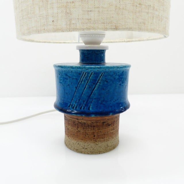 Scandinavian stoneware table lamp designed by Inger Persson for the Swedish manufacturer Rörstrand in the 1960s. The base...