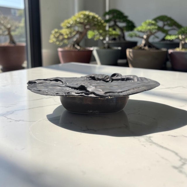 A substantial late twentieth-century American studio pottery Ikebana vessel, hand formed in a lightweight white ceramic...