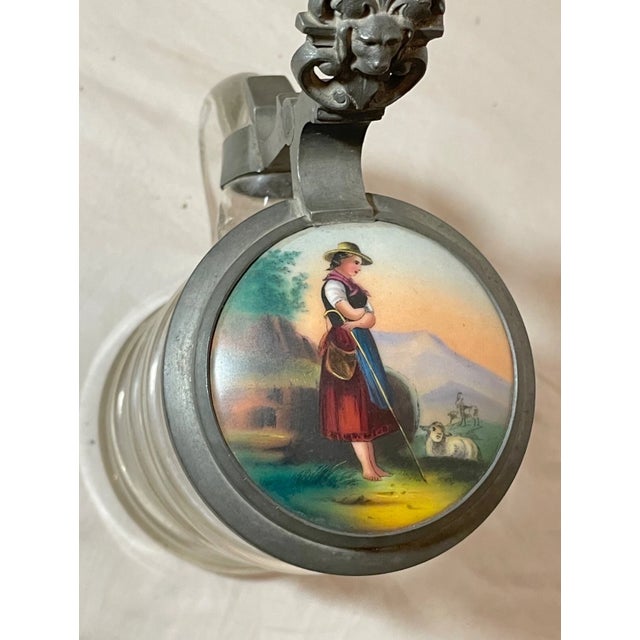 Up for sale is a nice quality antique glass and pewter/porcelain lidded German beer stein. The pewter lid has a wonderful...