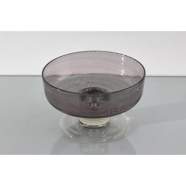 A centerpiece/bowl by Tapio Wirkkala, from the "Rovaniemi" series for Venini, Italy, 1972. Black filigree on smoked glass...