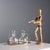 A chiseled silver oil cruet with applied side decorations in the shape of a swan with outstretched wings. Silver hallmarks...