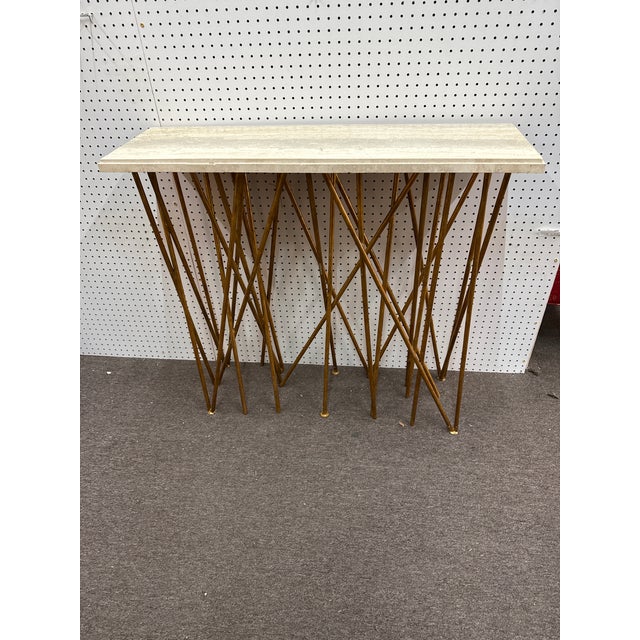 Fantastic Sculptural Console Table by Ambella Home. The table is comprised of hand forged iron with an antique gold leaf...