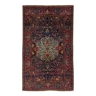 Antique Kerman Persian Navy Blue Wool Rug With a Rosette Motif For Sale