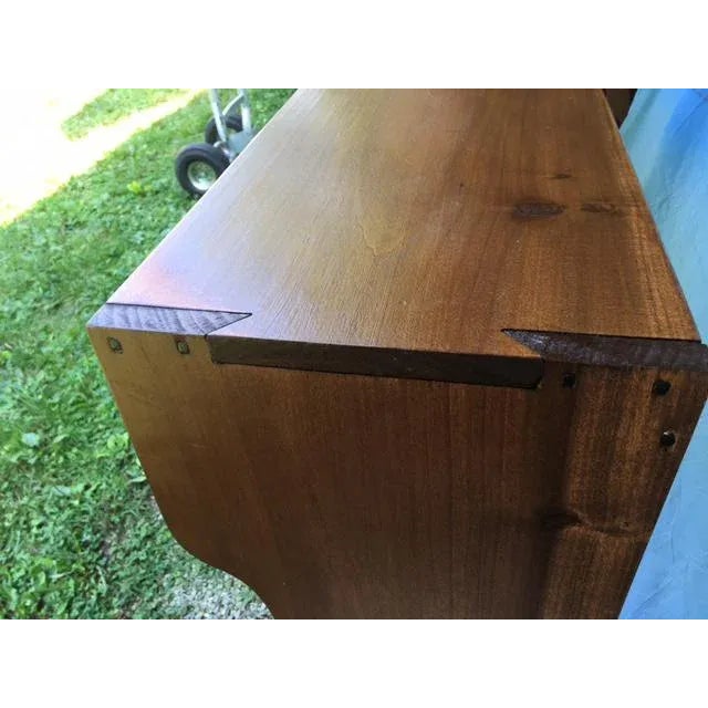 This is a beautifully crafted piece. Look at the dovetail joint detail that secures the sides to the top, and the...