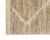Luxuriously hand-knotted wool rug displaying a distinctive pattern with diamond motifs transitioning into an abstract,...