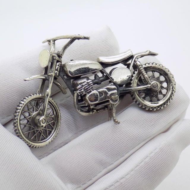 A solid, heavy, and extraordinarily detailed piece, complete with a fully functional kickstand, showcasing an impressive...