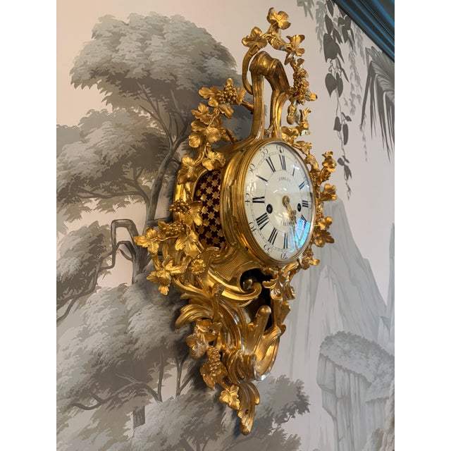 This is an absolutely stunning and eye catching fully functioning Louis XVI period cartel clock made by Corlet A...