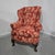 In excellent overall condition, mahogany wing backed chair, with feather filled cushion and wonderful goat hoof legs. 39"...