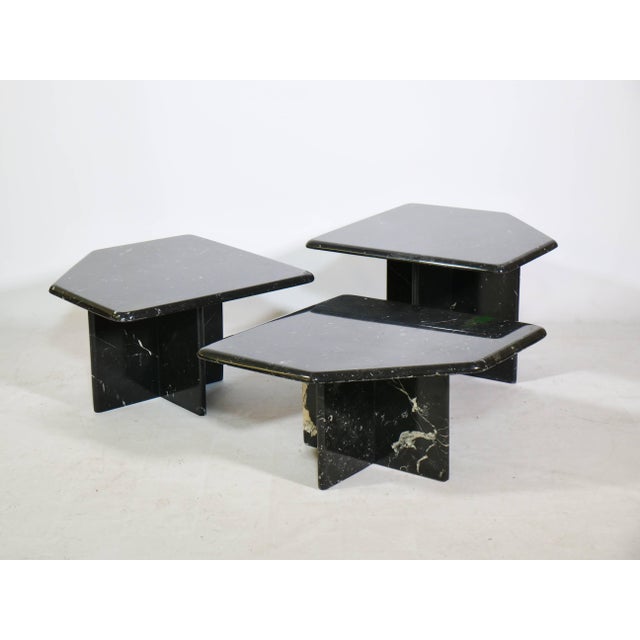 Set of three coffee tables in a geometric, organic shape with rounded corners. A stunning postmodern, minimalist design....