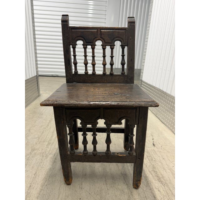 Italian Renaissance carved walnut side chair, cataloged as 17th century. Measuring 32” H × 18” W × 13” D, this petite...