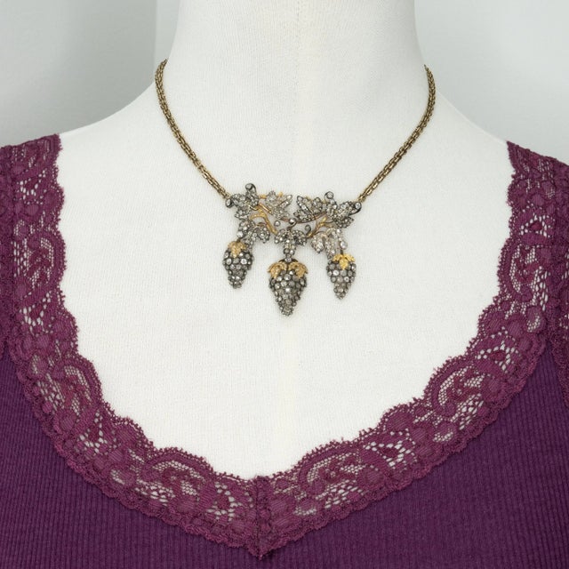 Fabulous Victorian diamond grape and leaf motif drop pendant necklace crafted in 14K yellow gold and silver top with a...