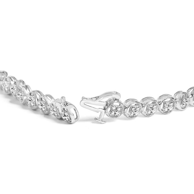 Imbued with the glow of impeccable .925 sterling silver, this tennis bracelet marries modern sophistication with a whisper...