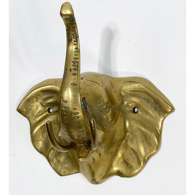 Charming vintage brass elephant wall hook with 'trunk up' for good luck. No maker's mark. Patina. Hardware screws to...