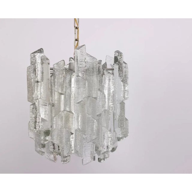1 of 8 rare and striking chandeliers by kalmar, model prisma, produced in the 1970s. This impressive light features a...