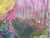 A dreamlike landscape unfolds in bright yellows and mysterious shades of purple. Trees meet the quiet lake, their...