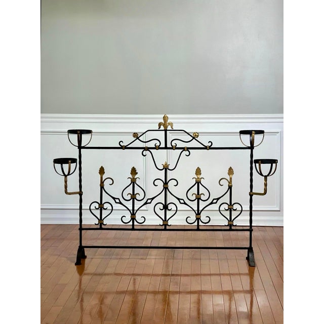 Grand scale French wrought iron four-cup landier hearth screen with gold fleur-de-lis in the Belle Époque taste, circa...