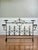 Grand scale French wrought iron four-cup landier hearth screen with gold fleur-de-lis in the Belle Époque taste, circa...