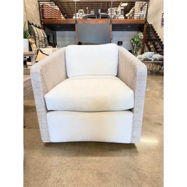 Palecek Kirk Nix Collection swivel lounge chair featuring a hardwood frame wrapped in hand-woven lampakanay rope in a soft...