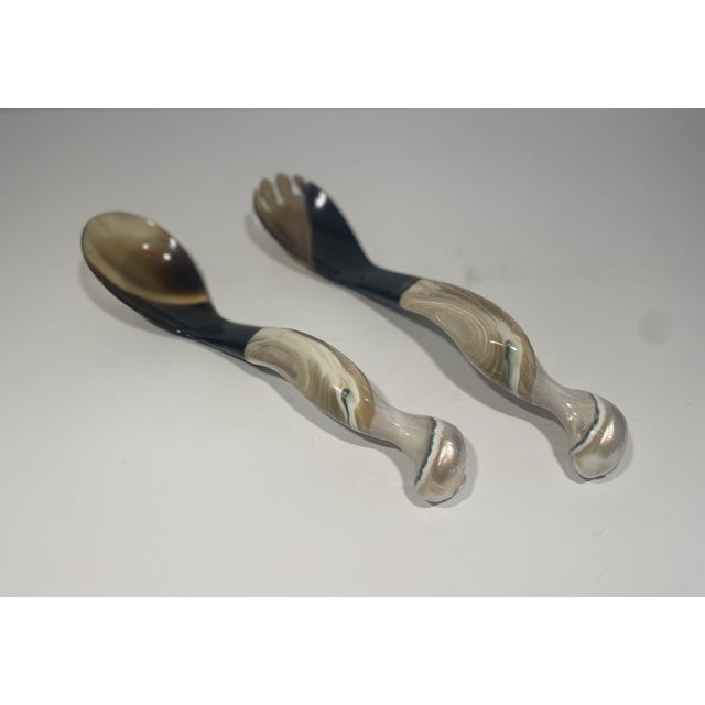 These serving utensils are handmade by a Vietnamese artist, and have a decidedly organic feel to them.. They are made of...