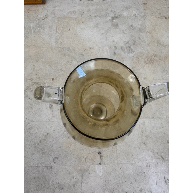 Murano glass amphora vase designed by Vittorio Zecchin for Venini, Italy, circa 1920. Blown in a warm amber tone, the vase...